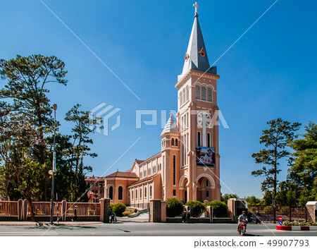 Da Lat Cathedral Motorcycle running pass in front Da Lat Cathedral Motorcycle running pass in front 49907793