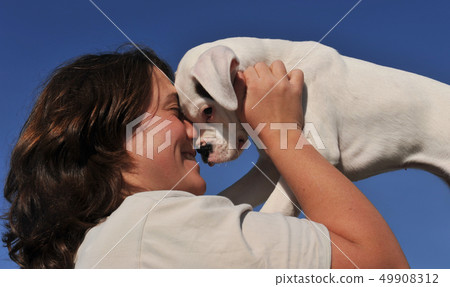 young woman and puppy 49908312