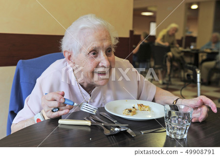 senior woman eating senior woman eating 49908791