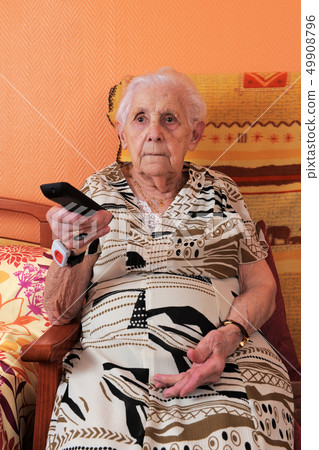 senior woman and remote control senior woman and remote control 49908796