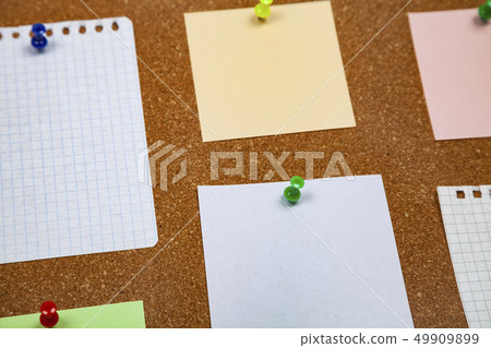 Corkboard with notes. 49909899