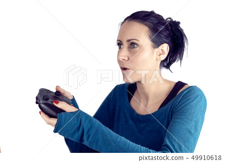 Concentrated woman playing video game Concentrated woman playing video game 49910618