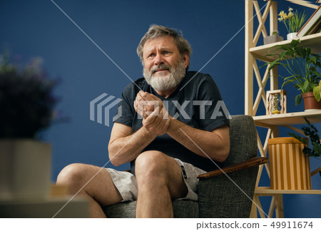 Old bearded man suffering from pain Old bearded man suffering from pain 49911674