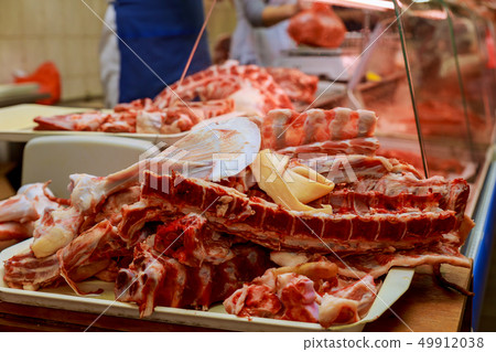Butcher Preparing Meat In Shop 49912038