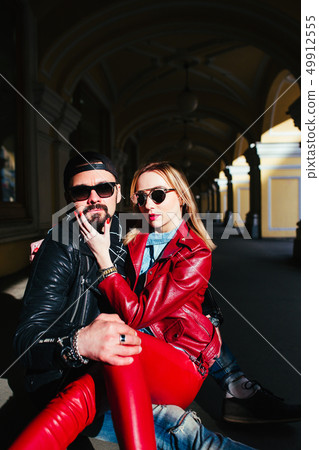 Sexy couple in leather jacket hugging each other Sexy couple in leather jacket hugging each other 49912555