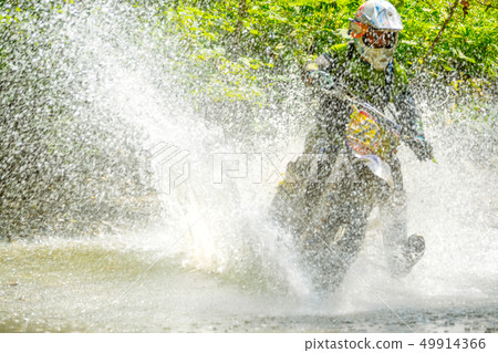 Sport Bike Driver and Water Spray 49914366