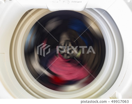 Top view of a washing machine drum during spinning Top view of a washing machine drum during spinning 49917063