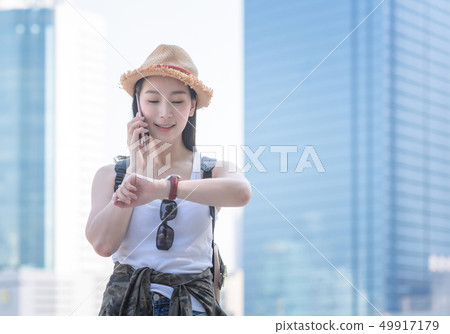 Beautiful asian solo tourist woman smiling Beautiful asian solo tourist woman smiling 49917179