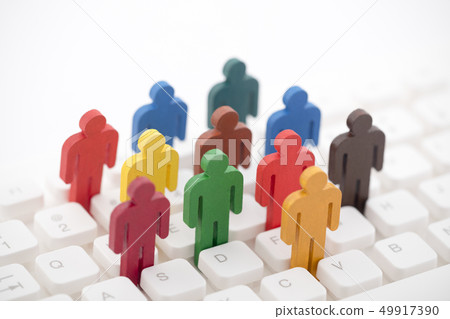 Colorful group of people figures on keyboard 49917390