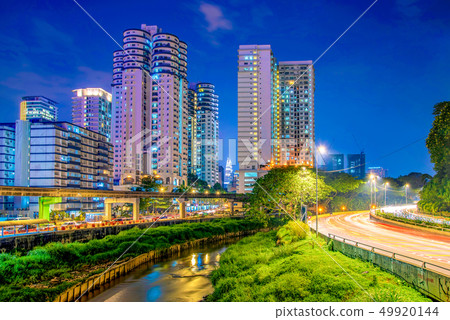 Riverside apartment buildings at night 49920144