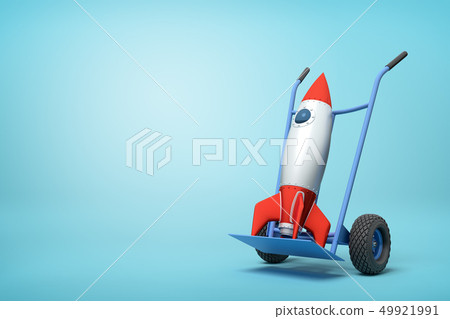 3d rendering of toy space rocket on blue hand truck which is standing in half-turn on light-blue 49921991
