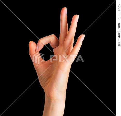 Woman holding hand in gesture of okay. Sign of success, victory or luck Woman holding hand in gesture of okay. Sign of success, victory or luck 49924229