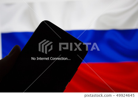 Smartphone in hand without internet connection on the background of the Russian flag 49924645