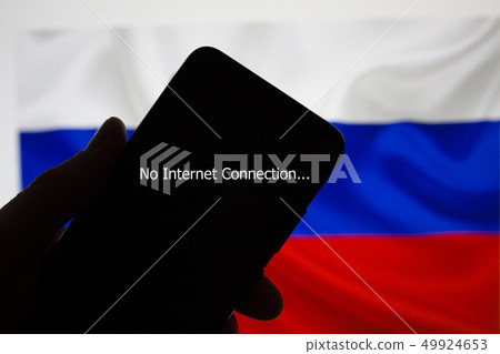 Smartphone in hand without internet connection on the background of the Russian flag 49924653