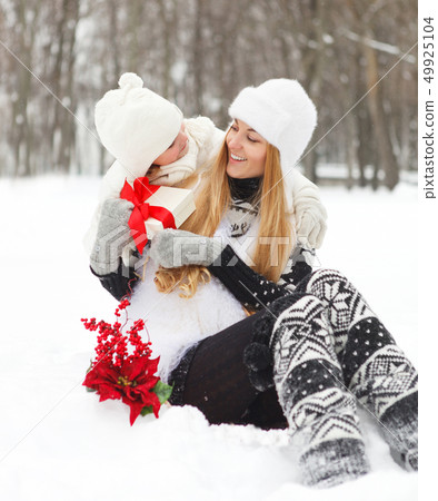 Happy young mother with daughter with present Happy young mother with daughter with present 49925104