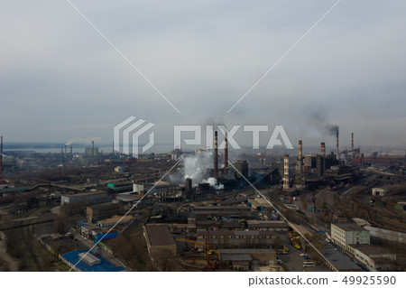 Polluting plant shot from above with a drone 49925590