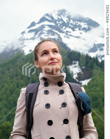 Tourist girl with a backpack 49925682