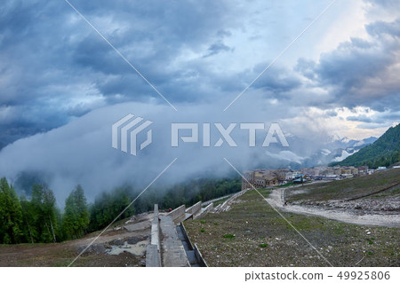 Ski resort in the spring against the mountains Ski resort in the spring against the mountains 49925806
