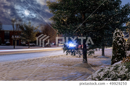 Night of winter car headlights on a snowy night 49929250