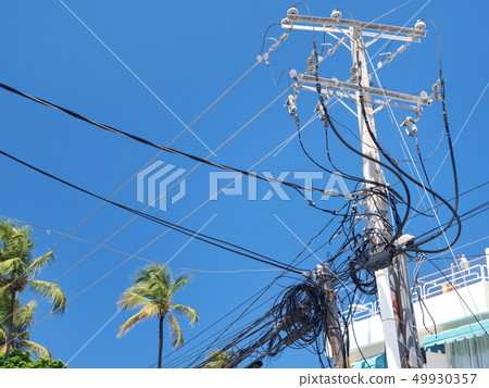 Electric tower with untidy cables and wires on Electric tower with untidy cables and wires on 49930357