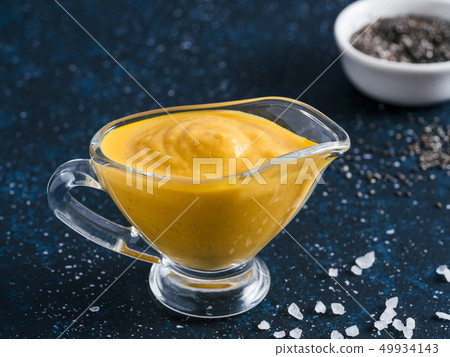 Vegan creamy cheddar cheese sauce with chia seeds Vegan creamy cheddar cheese sauce with chia seeds 49934143