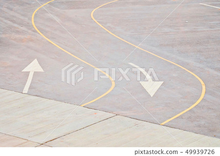 Traffic curved line and white arrow symbol on road 49939726