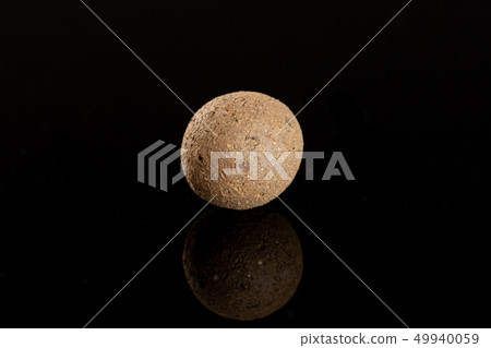 Clay pebbles (leca) isolated on black glass Clay pebbles (leca) isolated on black glass 49940059