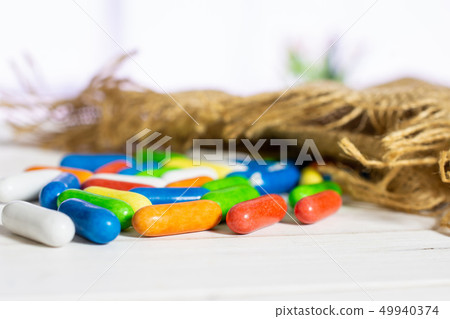 Licorice sweet comfit with red tulips Licorice sweet comfit with red tulips 49940374