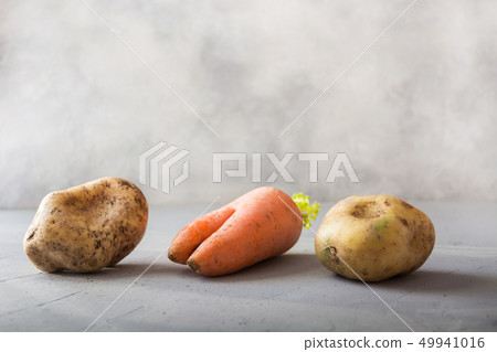 Ugly organic vegetables carrot and potatoes. Ugly organic vegetables carrot and potatoes. 49941016