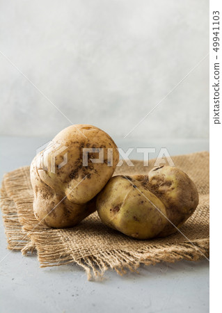 Ugly organic potatoes. Space for text. Concept Ugly organic potatoes. Space for text. Concept 49941103