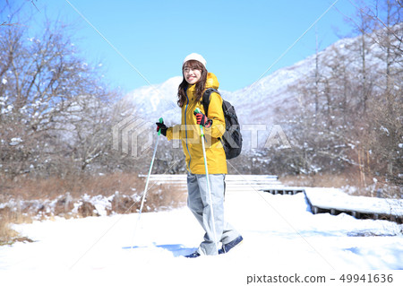 Woman enjoying winter leisure Woman enjoying winter leisure 49941636