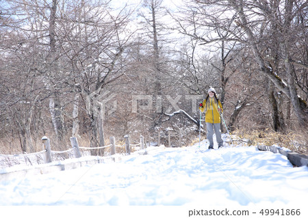 Woman enjoying winter leisure Woman enjoying winter leisure 49941866