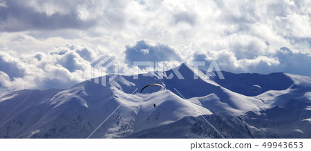 Panoramic view on skydiver at evening cloudy Panoramic view on skydiver at evening cloudy 49943653
