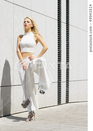 Woman wearing crop top and culottes 49943814