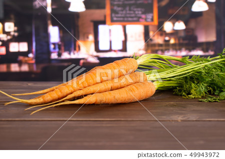 Fresh orange carrot with restaurant Fresh orange carrot with restaurant 49943972