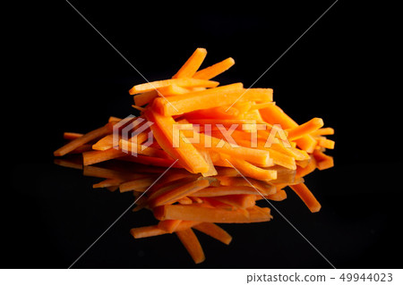 Fresh orange carrot isolated on black glass 49944023