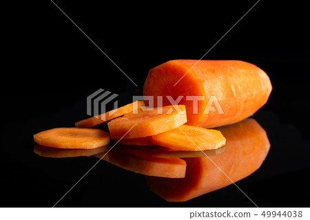 Fresh orange carrot isolated on black glass 49944038