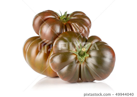 Fresh dark tomato primora isolated on white Fresh dark tomato primora isolated on white 49944040
