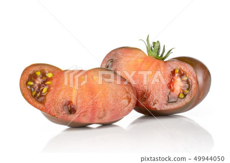 Fresh dark tomato primora isolated on white Fresh dark tomato primora isolated on white 49944050