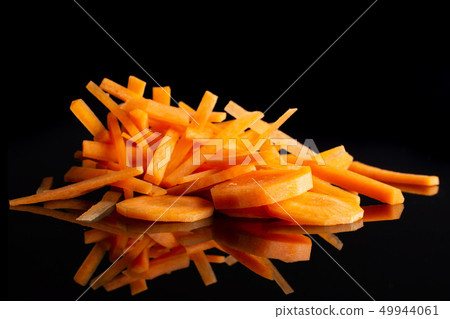 Fresh orange carrot isolated on black glass 49944061