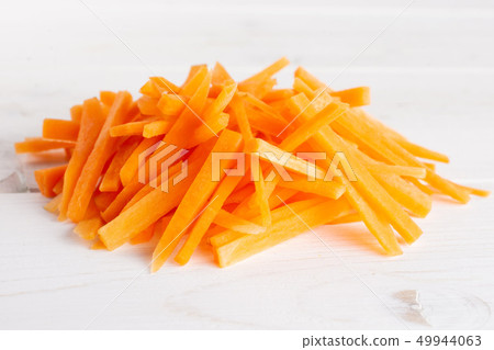 Fresh orange carrot on grey wood 49944063