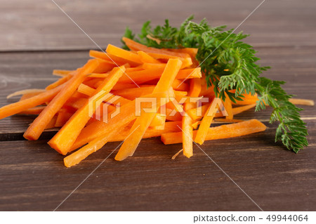 Fresh orange carrot on brown wood 49944064