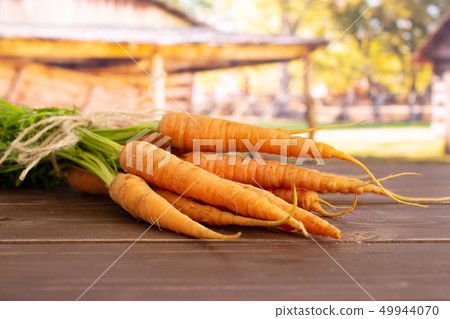 Fresh orange carrot with cart Fresh orange carrot with cart 49944070