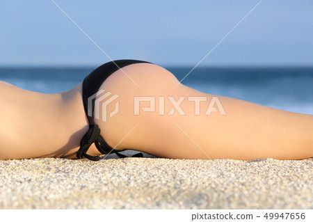 Profile of a butt of a woman with a bikini 49947656