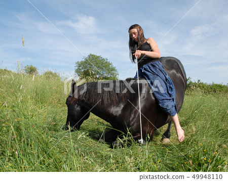 horse laid down and riding girl horse laid down and riding girl 49948110