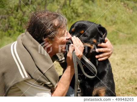 man and rottweiler man and rottweiler 49948203