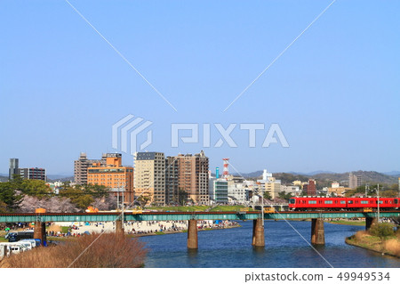 Okazaki city in spring Okazaki city and Meitetsu train Okazaki city in spring Okazaki city and Meitetsu train 49949534