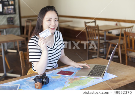 A young woman who plans to travel abroad A young woman who plans to travel abroad 49952370