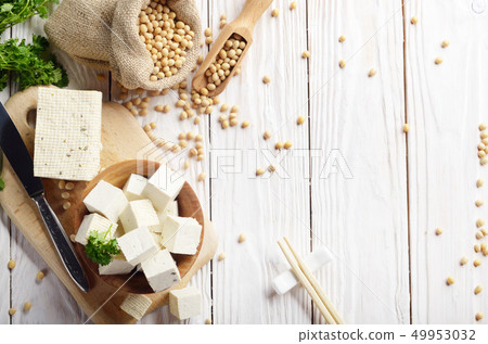 Soy Bean curd tofu in wooden bowl and in hemp sack 49953032