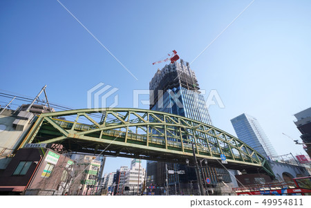 Skyscrapers in front of the "Shanghei Bridge" intersection that reveals Tokyo cityscape in Japan Skyscrapers in front of the "Shanghei Bridge" intersection that reveals Tokyo cityscape in Japan 49954811